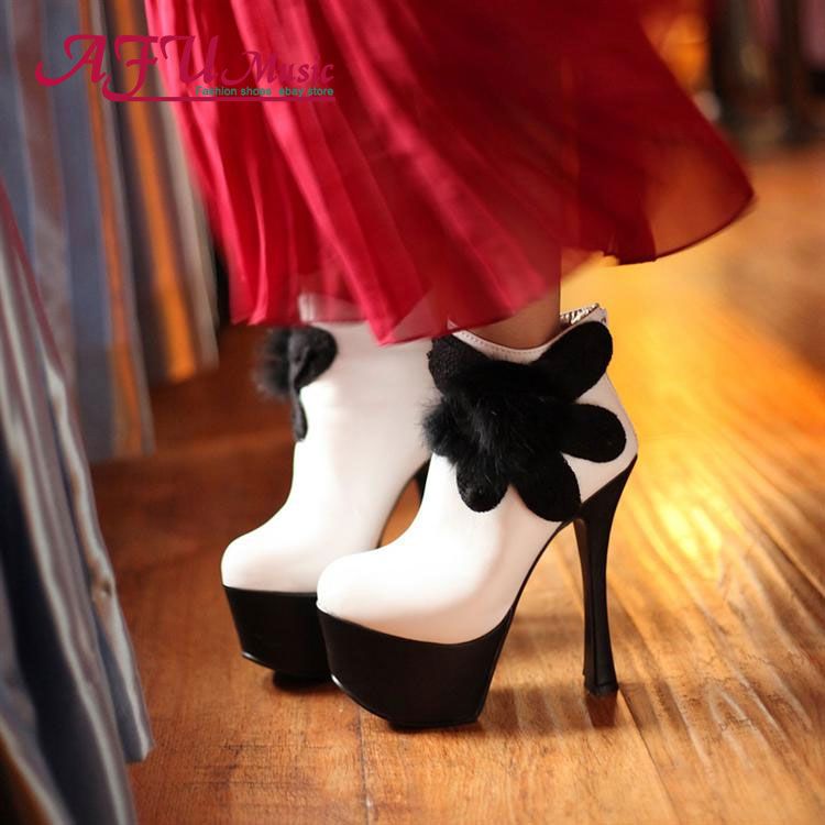 white and black high heel boots